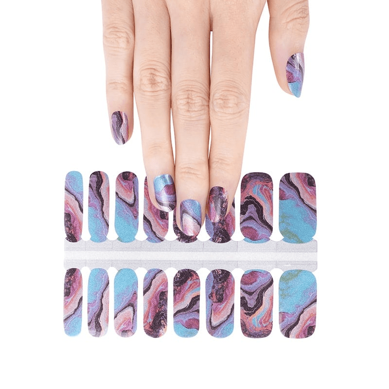 Blue and pink marble swirl nail wraps on hand with abstract stone pattern design