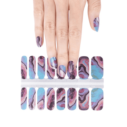 Blue and pink marble swirl nail wraps on hand with abstract stone pattern design