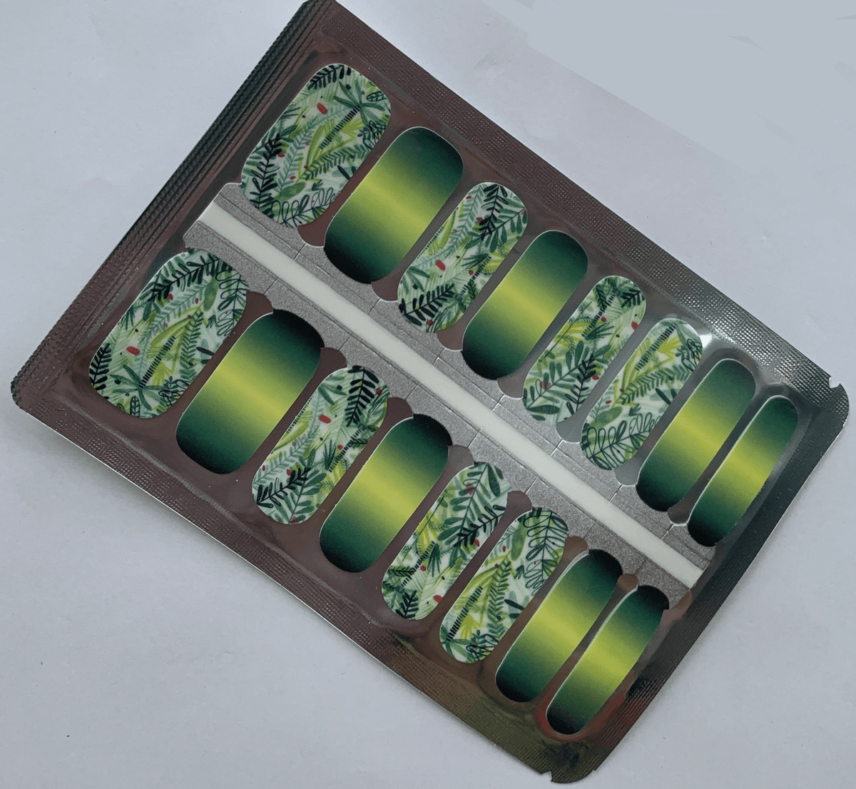 Forest themed non-UV nail wraps featuring green gradient and botanical leaf designs