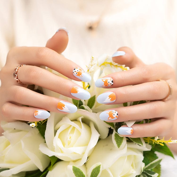 Fox nail wraps manicure on hands holding white flowers showing kawaii fox design