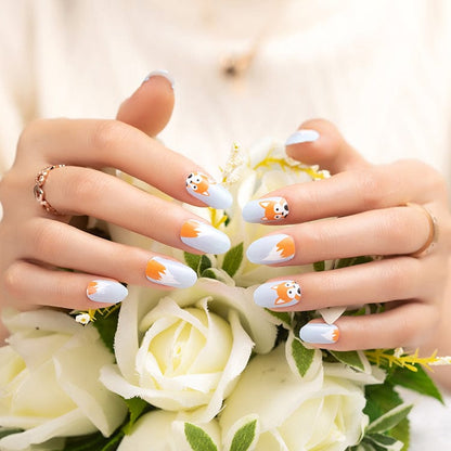Fox nail wraps manicure on hands holding white flowers showing kawaii fox design