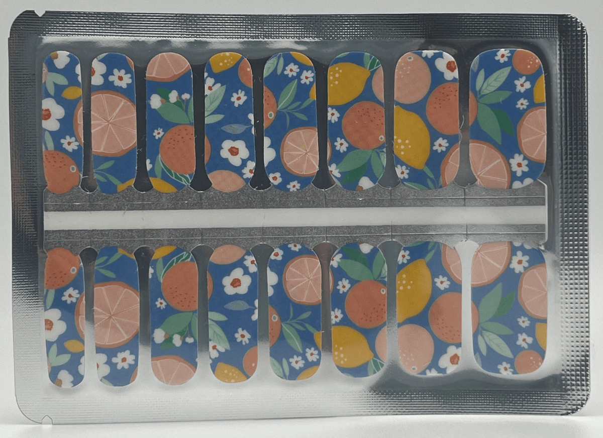 Non-UV nail wraps sheet displaying fruit and flower pattern in blue orange colours