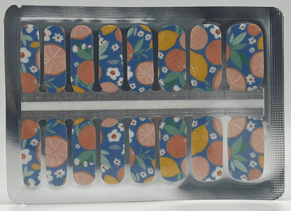 Non-UV nail wraps sheet displaying fruit and flower pattern in blue orange colours