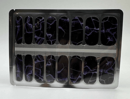 Black nail wraps with purple blue lightning pattern in packaging, complete manicure set