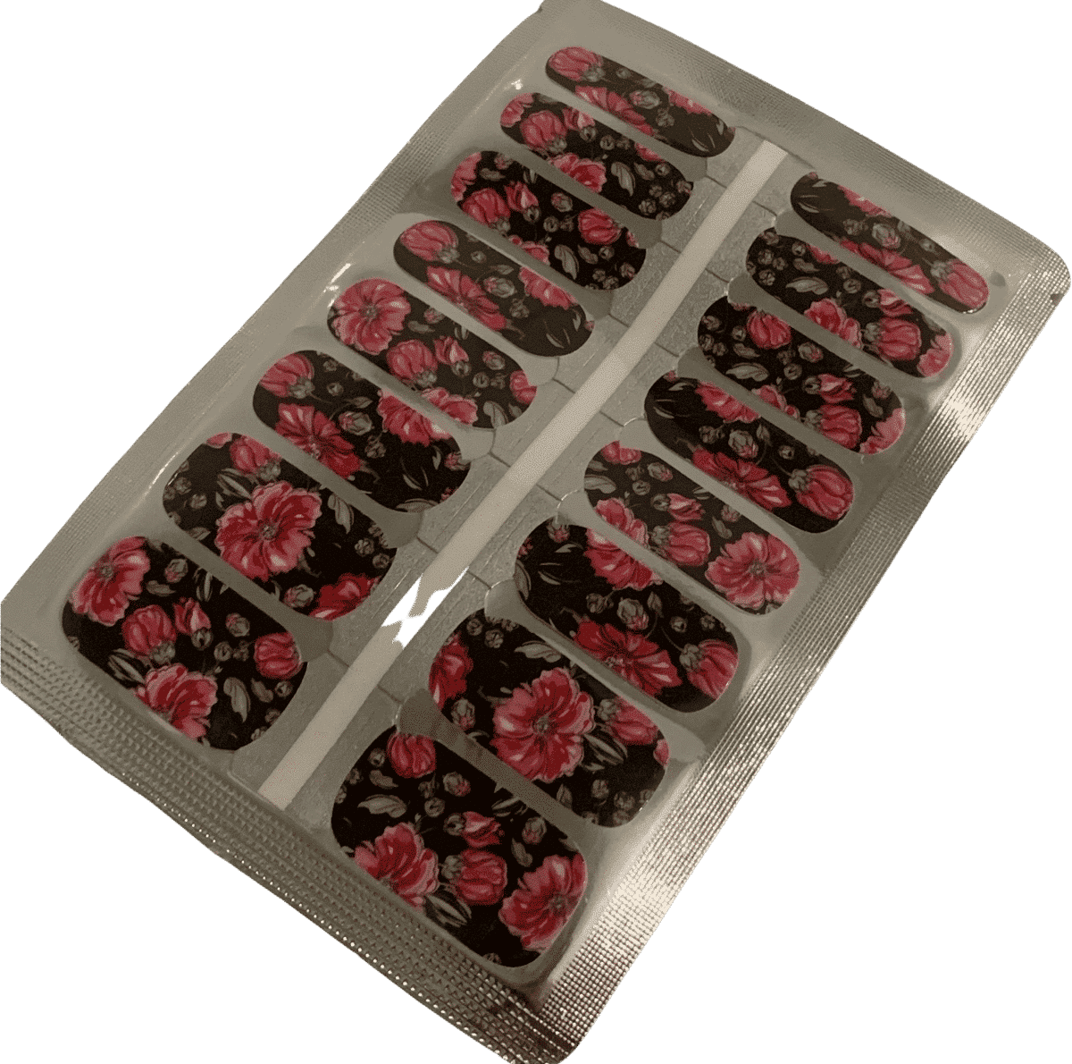 Sheet of dark botanical nail wraps featuring coral pink flowers on black base