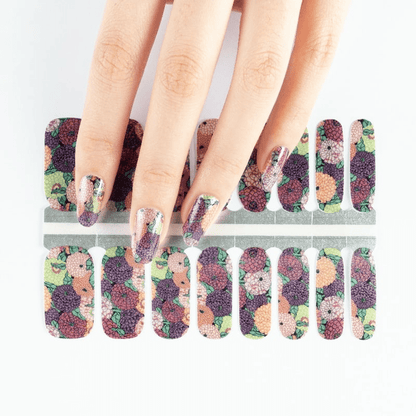 Floral geranium nail wraps on hand with botanical multicoloured vintage pattern design