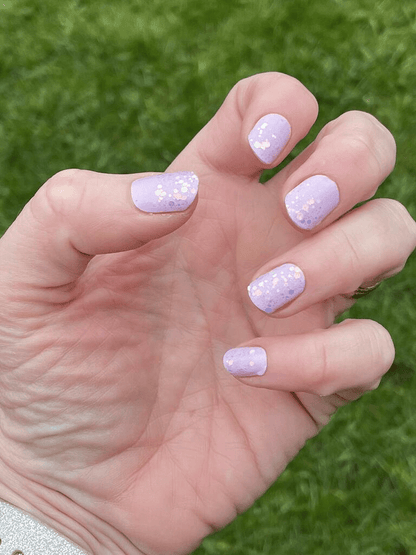 Lilac purple sparkly non-UV nail wraps on hand showing glitter gradient design