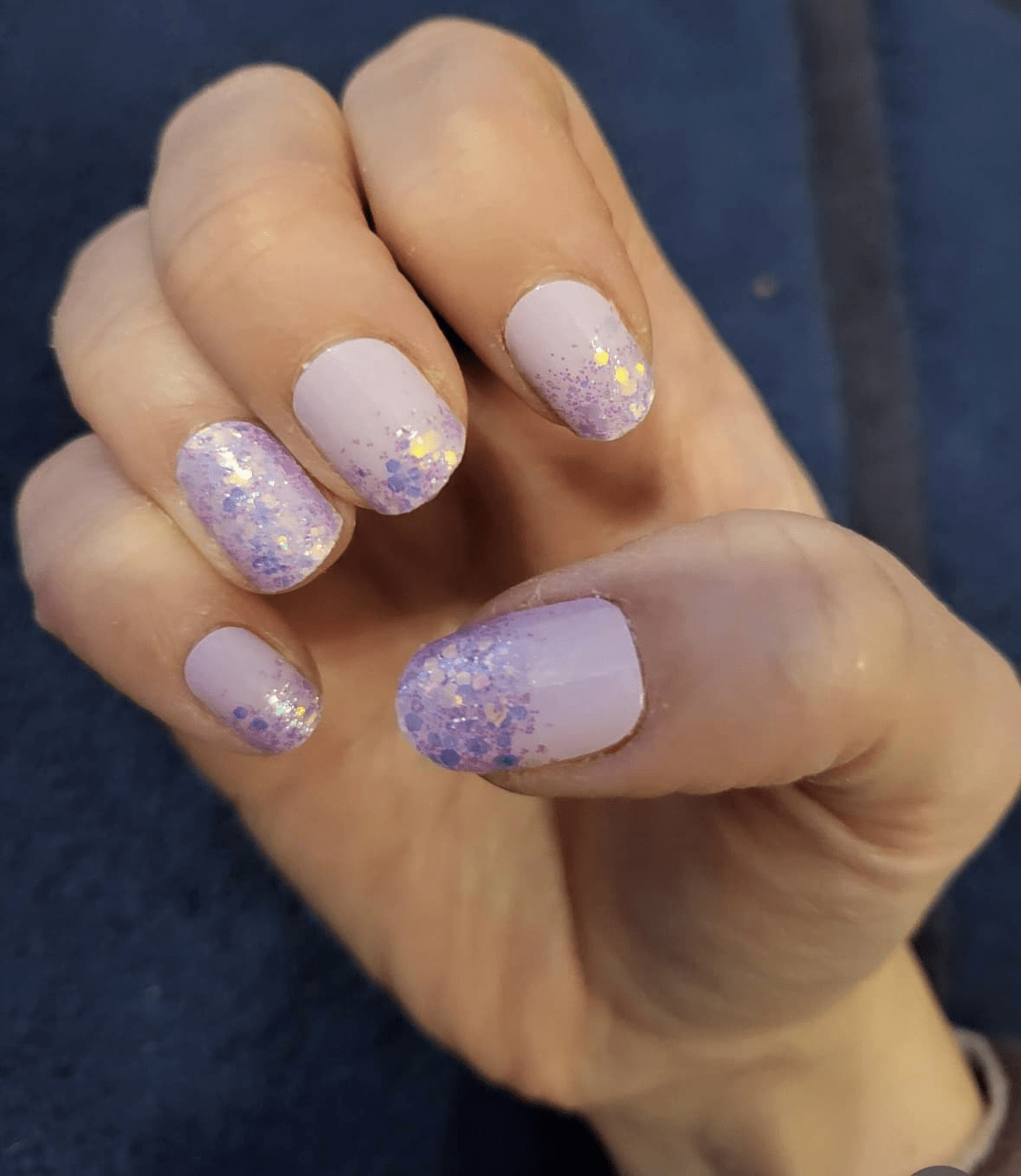 Purple to pink glitter nail wraps on short nails with ombré sparkle design