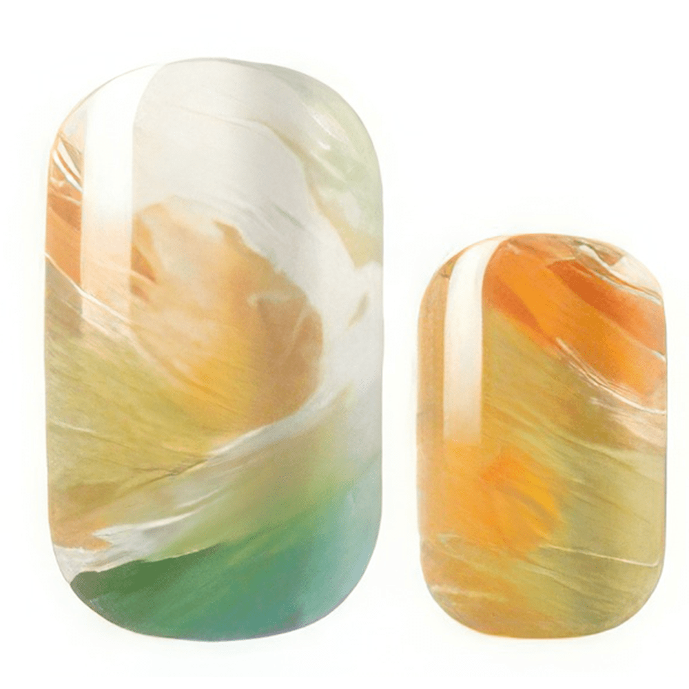 Close-up golden orange marble nail wraps showing swirled metallic finish