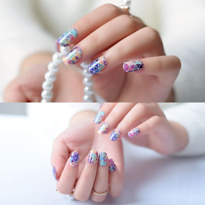 Triangle pattern nail wraps on hands displaying purple pink geometric mosaic design