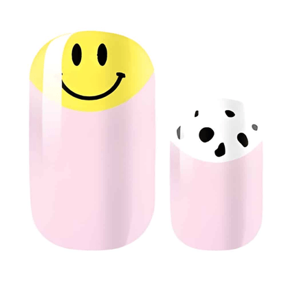 Non-UV nail wraps featuring yellow smiley face and black spotted patterns on pink