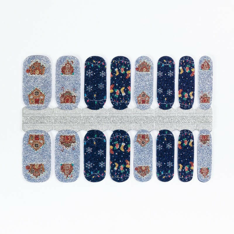 Festive Christmas nail wraps with gingerbread men, snowflakes and navy blue holiday patterns