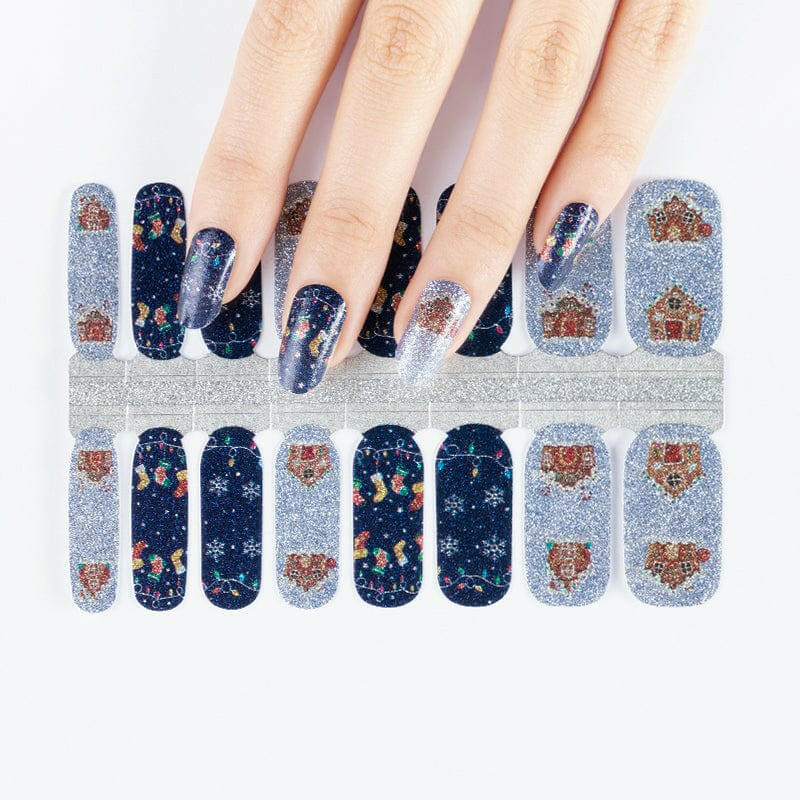 Navy and silver glitter nail wraps with gingerbread houses, snowflakes and fairy lights