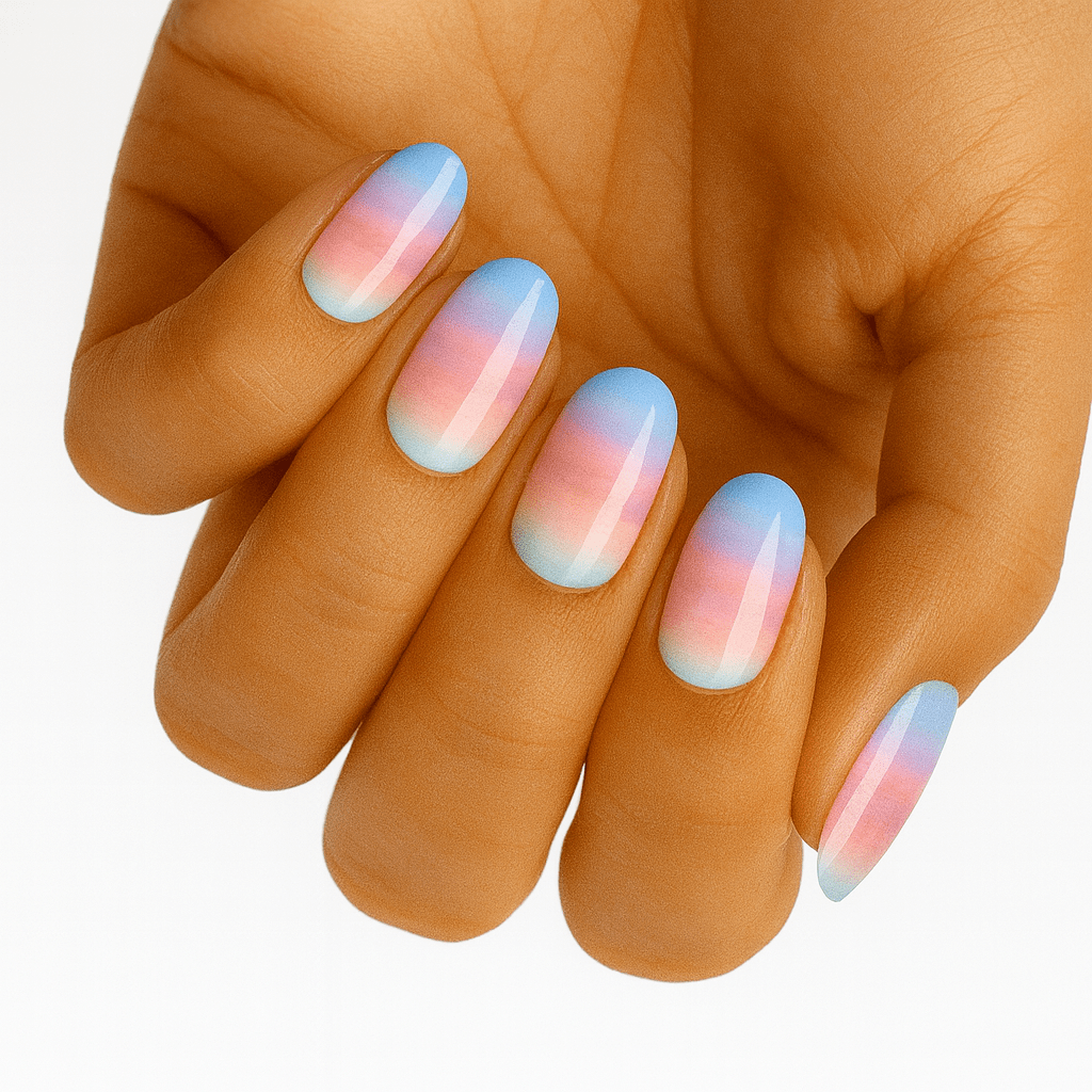 Blue pink gradient ombre nail wraps on hand showing pastel manicure design