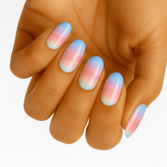 Blue pink gradient ombre nail wraps on hand showing pastel manicure design