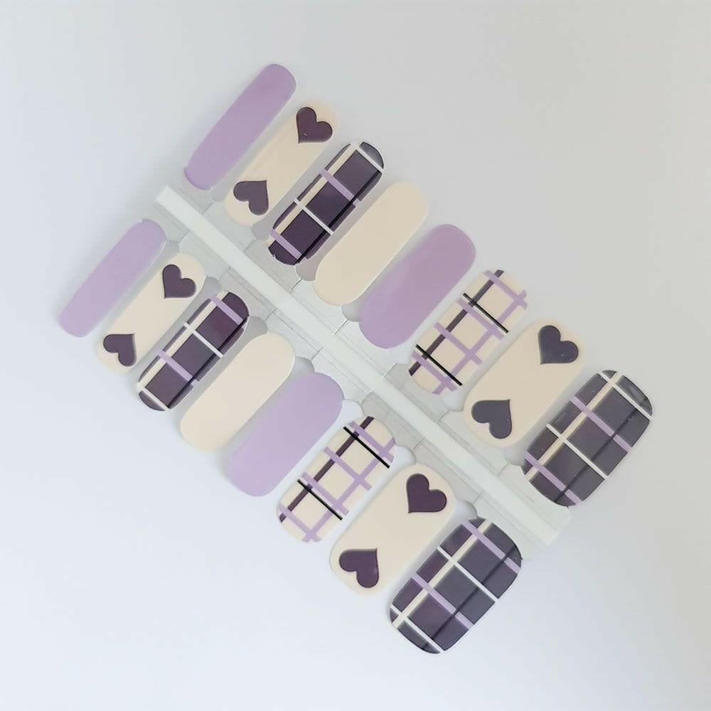 Purple lavender nail wraps with tartan plaid pattern and heart motifs for at-home manicure