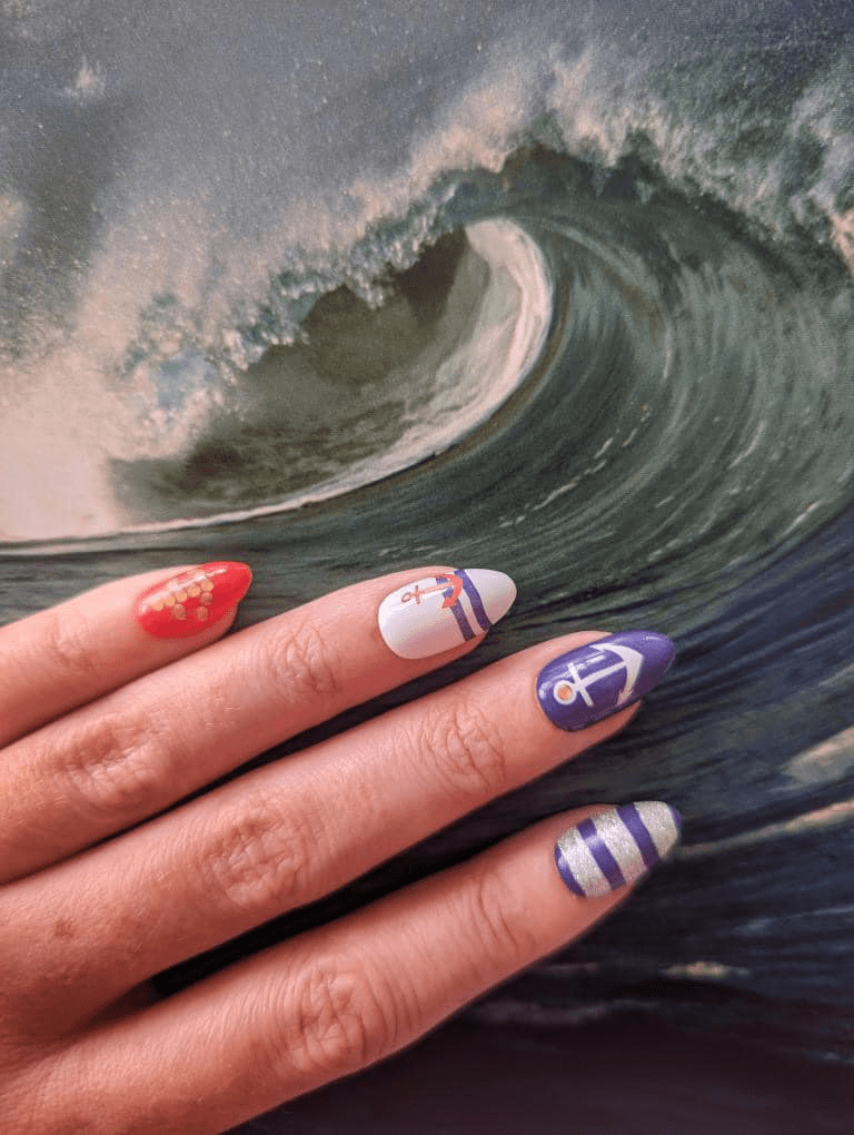 Nail wraps with red, white, purple and silver nautical anchor and stripe design