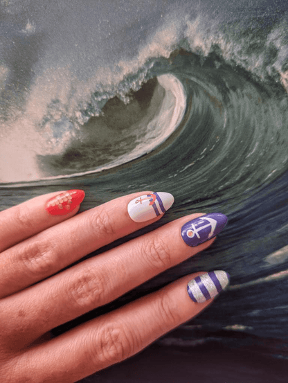 Nail wraps with red, white, purple and silver nautical anchor and stripe design