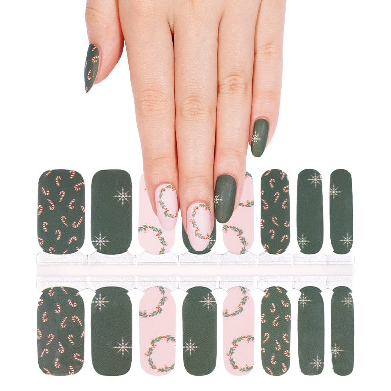 Christmas nail wraps sheet showing green matte and pink holly wreath designs with snowflakes