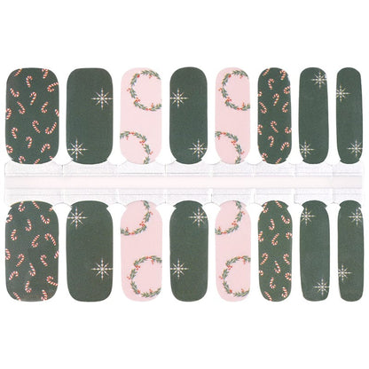 Non-UV Christmas nail wraps sheet featuring green and pink holly snowflake patterns