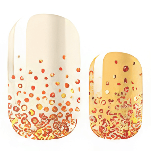 Cream and orange gradient nail wraps with gold glitter dots and textured design