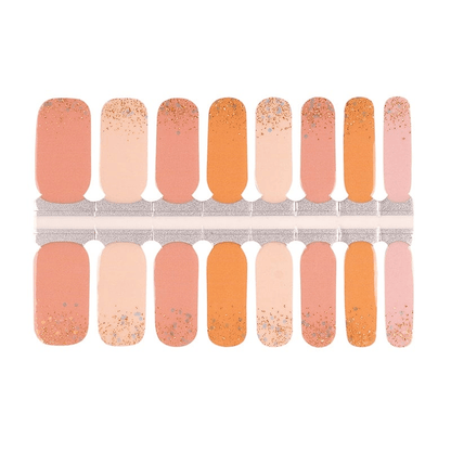 Orange gradient nail wraps with gold glitter ombre finish in warm autumn tones