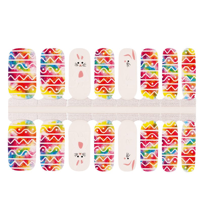 Easter nail wraps sheet featuring bright multicoloured chevron patterns with adorable white bunny faces