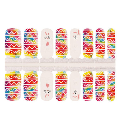 Easter nail wraps sheet featuring bright multicoloured chevron patterns with adorable white bunny faces