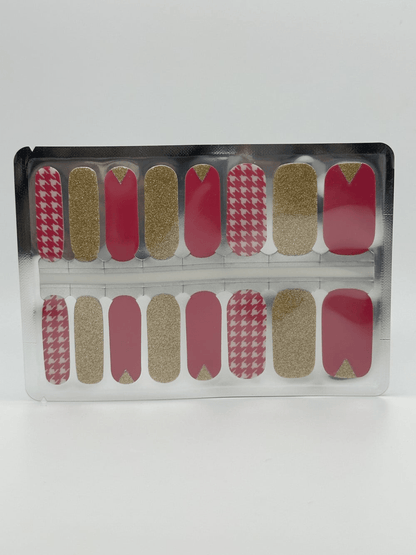 Complete set of pink and gold glitter houndstooth nail wraps in clear packaging