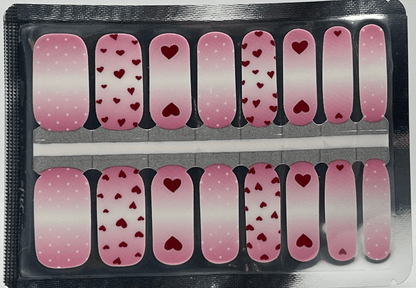 Pink heart patterned nail wraps sheet showing polka dot and romantic Valentine's nail designs