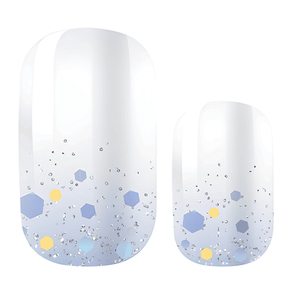 Ice blue nail wraps with hexagonal glitter confetti pattern and gradient finish