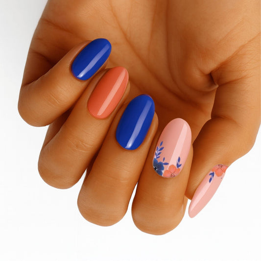 Bright coral blue nail wraps with floral accents in coastal colour block design on hand