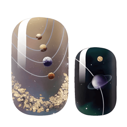 Intergalactic nail wraps featuring planets and gold leaf details on dark space-themed background