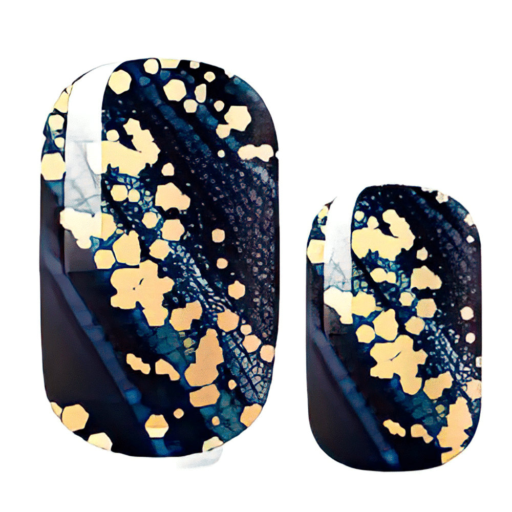 Navy blue nail wraps with gold glitter speckles and celestial pattern for at-home manicure