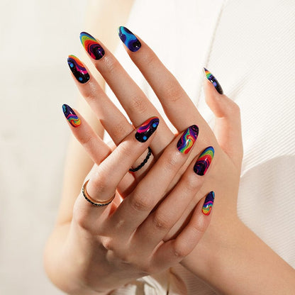 Hands displaying colourful abstract nail art with electric blue pink swirl nail wraps