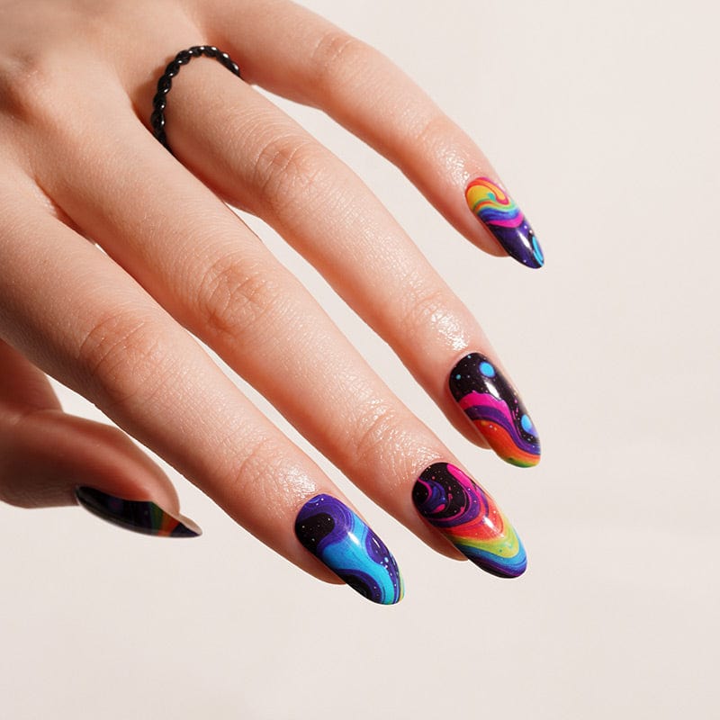 Vibrant multicoloured abstract nail wraps on hand showing iridescent rainbow swirl patterns