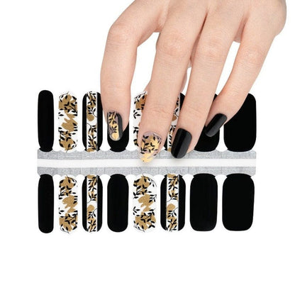 Classic nail wrap sheet with black and bronze floral patterns for at-home manicure
