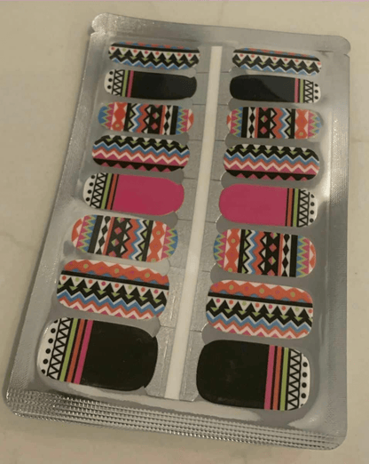 Non-UV nail wraps sheet with tribal geometric patterns in pink green black chevron stripes