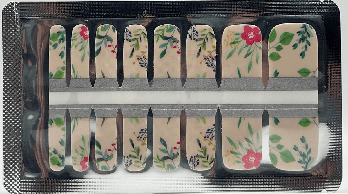 Green botanical pedicure wraps in packaging showing floral leaf pattern design