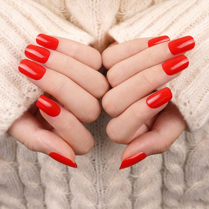 Glossy red nail wraps in a classic solid colour on squoval nails