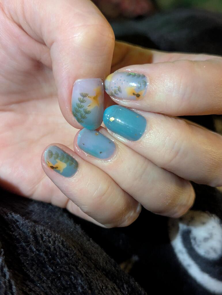 Teal and grey nail wraps with gold cranes and pine branch design