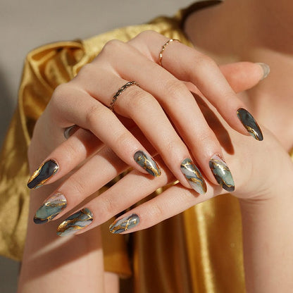 Almond nail wraps with grey-green marble design and gold foil veining, glossy finish