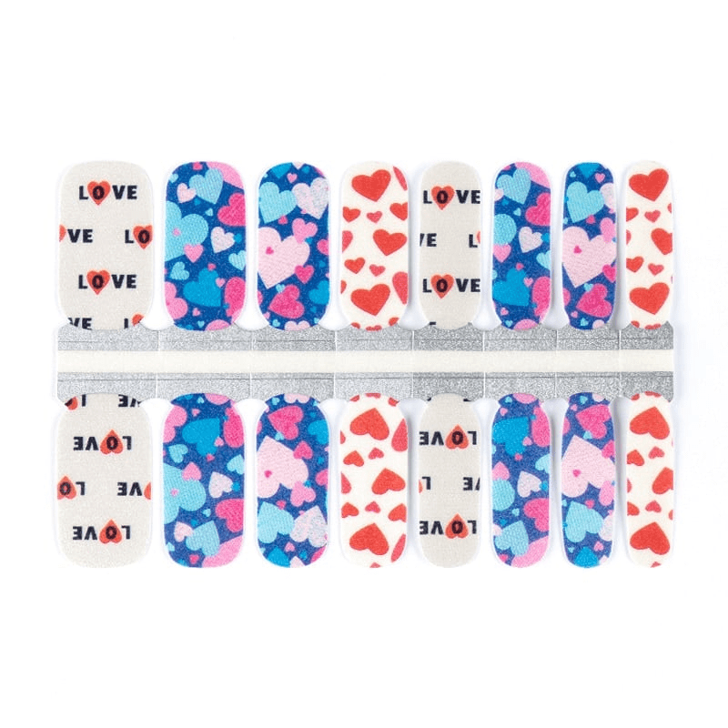 Complete nail wrap sheet featuring blue hearts and love typography patterns for DIY manicure