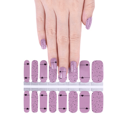 Pink nail wraps sheet with black dots and hearts pattern classic nail art design