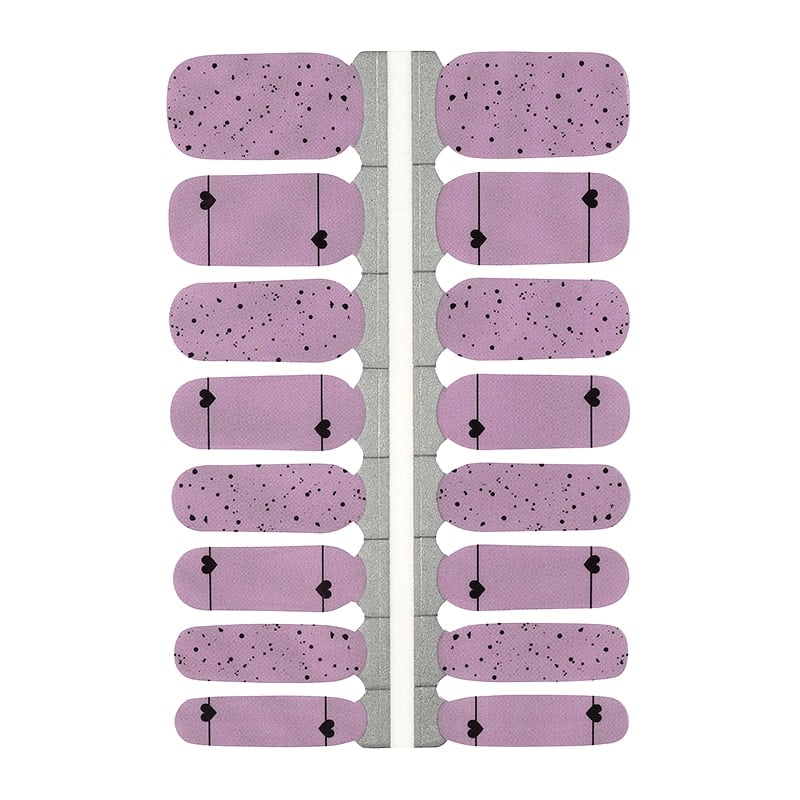 Pink nail wraps with black polka dots and heart patterns for at-home manicure