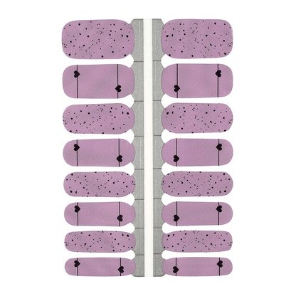 Pink nail wraps with black polka dots and heart patterns for at-home manicure