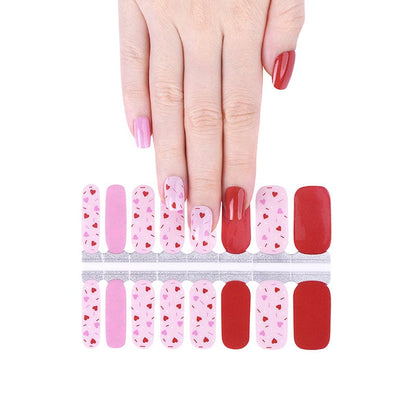 Pink and red nail wraps with heart print, solid pink and glossy red accent nails