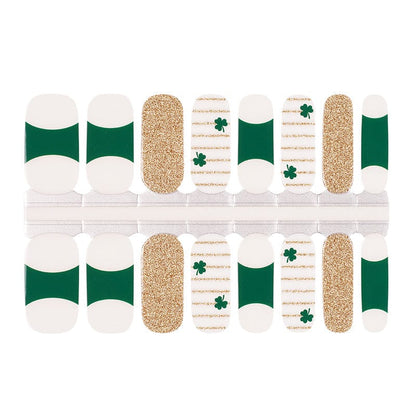 Holy Classics nail wraps in green and white with gold glitter and shamrock accents