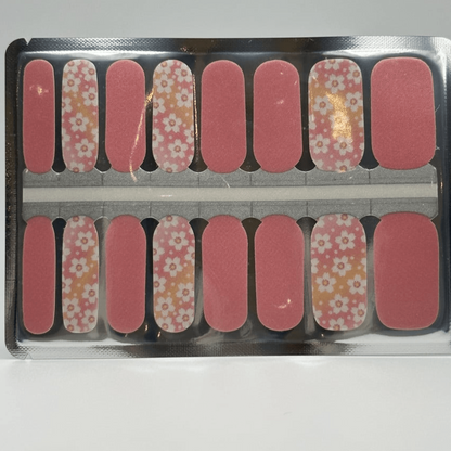 Pink floral nail wraps sheet showing white flower pattern and solid pink nail art designs