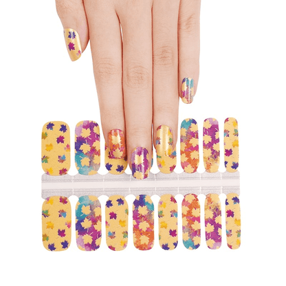 Non-UV nail wraps sheet with hand model showing autumn maple leaf nail art